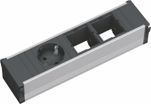 Bachmann CONI Steckdoseneinheit kurz 1x Schutzkontakt 2x Custom Module 912.002 Bachmann CONI Steckdoseneinheit - Flexibilität und Design für Ihren Arbeitsplatz Erleben Sie die perfekte Kombination aus Funktionalität und modernem Design mit der Bachmann CONI Steckdoseneinheit. Diese 3-fach Steckdoseneinheit bietet Ihnen eine flexible und elegante Lösung für Ihre Stromversorgung am Arbeitsplatz. Werkzeuglose Installation Die Bachmann CONI Steckdoseneinheit lässt sich mühelos in den Einbaurahmen einklicken. Hochwertige Materialien Eloxiertes Aluminiumprofil und schwarze Steckdosen sorgen für eine stilvolle Optik. Praktische Steckdosenanordnung Eine Schutzkontaktsteckdose ist um 35° gedreht, um den Anschluss von Winkelsteckern zu erleichtern. Individuelle Anpassung Zwei leere Module bieten Platz für individuelle Erweiterungen. Aluminiumprofil eloxiert Steckdosen schwarz 1 Schutzkontaktsteckdose 35° gedreht 2 x Modul leer 0,1 m, H05VV-F 3G 1,50 mm² schwarz Wieland GST 18i3 Stecker Vielseitige Einsatzmöglichkeiten: Ideal für Büros, Konferenzräume und Schulungsräume, wo eine flexible und ästhetisch ansprechende Stromversorgungslösung gefragt ist.