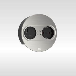 Bachmann TWIST 2 Steckdoseneinheit 1x Strom 1x USB-Charger A/C, rund Edelstahl-Optik 946.004 Neue Formen und hochwertige Oberflächen garantieren ein wertiges, kompaktes Design-Upgrade für Küche, Wohnzimmer und Office. Die neue TWIST 2 lässt sich automatisch per Knopfdruck öffnen und ist dadurch noch komfortabler zu bedienen. Nach Gebrauch wird das Cover einfach und sicher von Hand geschlossen. Dank neuer Anti-Fingerprint-Beschichtung verringern sich dabei Benutzerspuren und Fingerabdrücke 1x Steckdose, schwarz 1x USB A/C Charger 22W Abdeckscheibe in Edelstahl-Optik Einbaudurchmesser ca. 104 mm, Einbautiefe 40 mm Für Plattenstärken von 6 mm bis 40 mm Stromeingang: 2,0 m Zuleitung schwarz | H05VV-F |3G1,5mm² Mit Aderendhülsen und beigelegtem Montagestecker Platzsparende Kabelführung Einfache und schnelle Montage Maße (HxØ): ca. 42,5 x 115 mm